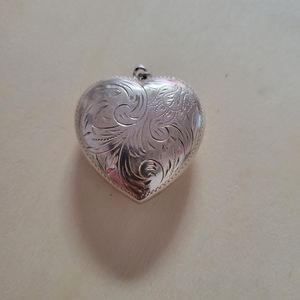 Sterling silver puffed etched head pendant